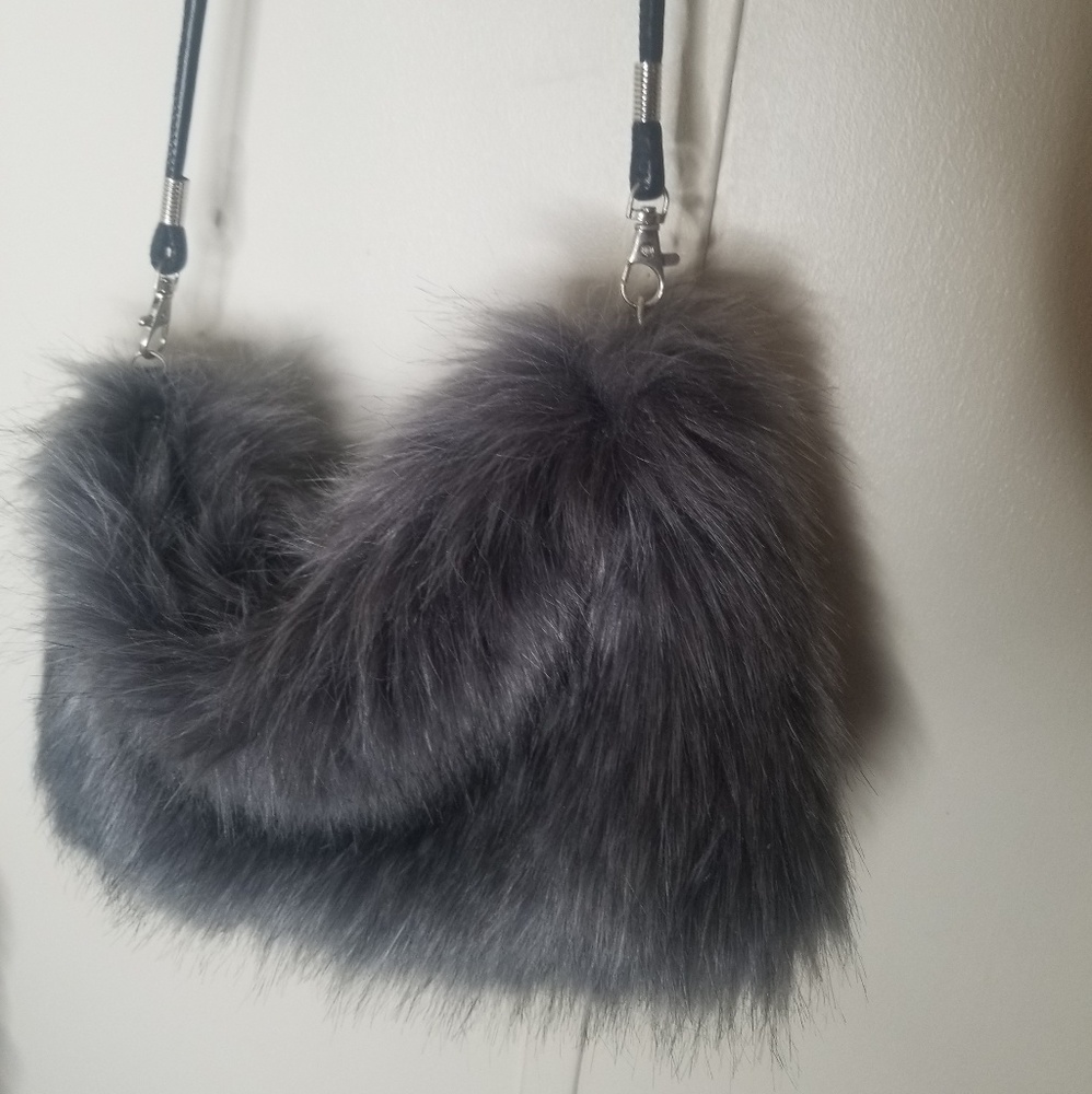 Grey furry purse with black removable strap